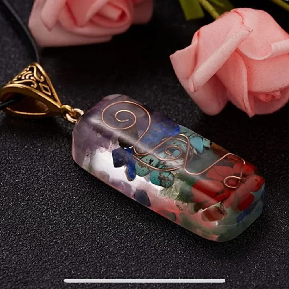 Pretty Chakra pendant necklace. 12”long with stones and bronze detail. Unisex
